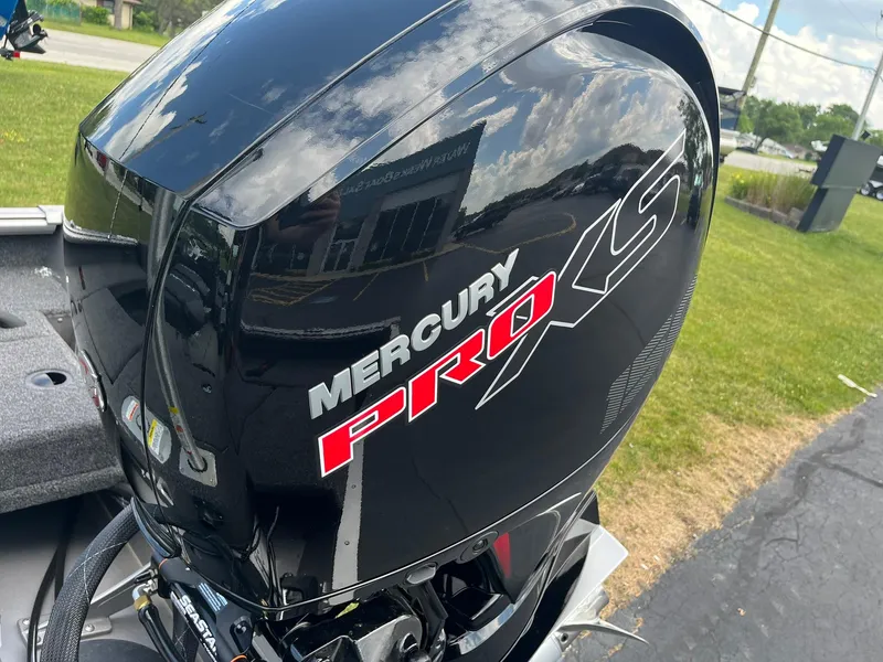 Slide: The Image of Mercury Pro XS engine on 2026 Lund 1875 Impact XS Sport boat, outdoors. - 26