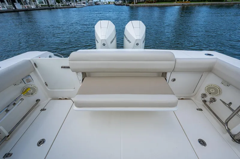 Slide: The Image of 2020 Boston Whaler 330 Outrage boat with comfortable seating and dual Mercury engines. - 30