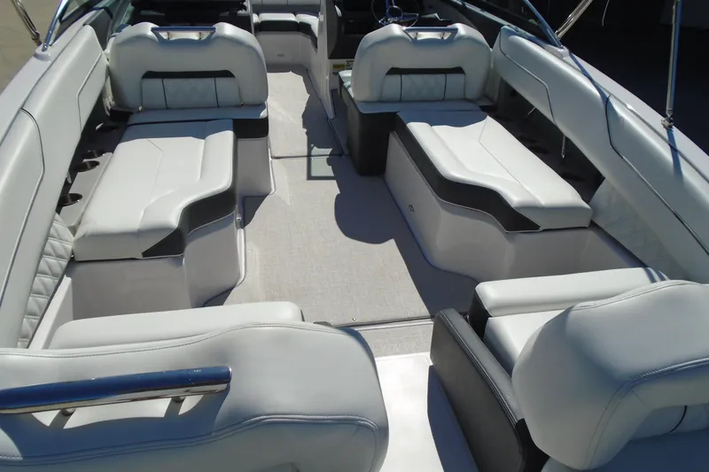 Slide: The Image of 2020 Regal LX4 boat interior with luxurious white seating and spacious layout. - 10