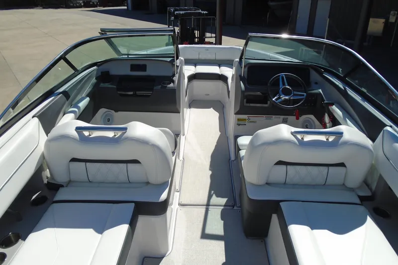 Slide: The Image of 2020 Regal LX4 boat interior with white seating and modern dashboard design. - 11
