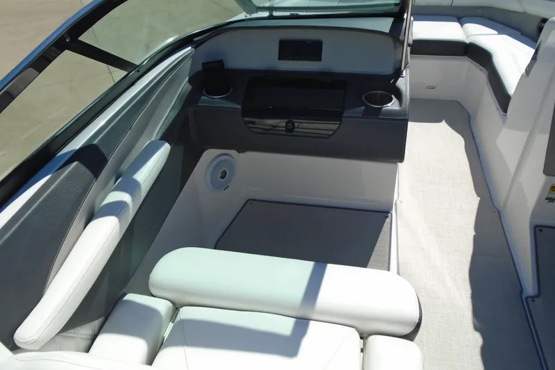Slide: The Image of 2020 Regal LX4 boat interior with white seating and modern dashboard design. - 12