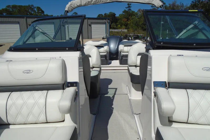 Slide: The Image of 2020 Regal LX4 boat interior with white leather seating and dual windshields. - 16