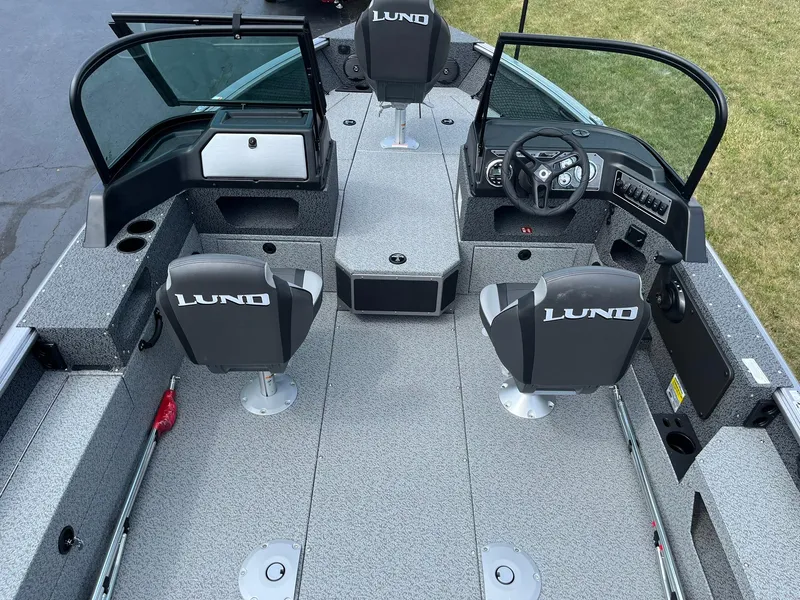 Slide: The Image of 2026 Lund 1875 Impact XS Sport boat displayed at Water Werks Boat Sales. - 2