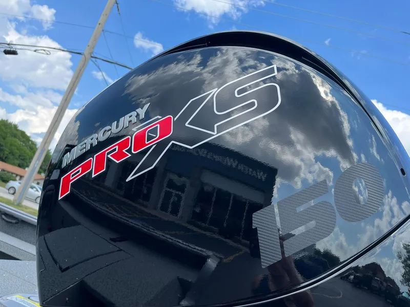 Slide: The Image of Interior of 2026 Lund 1875 Impact XS Sport boat with open storage compartment. - 23