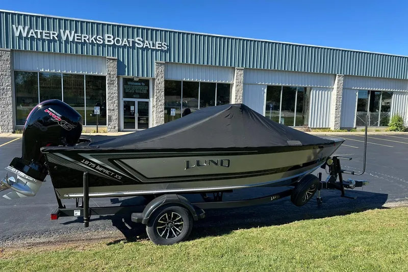 Slide: The Image of 2026 Lund 1875 Impact XS Sport boat at Water Werks Boat Sales dealership. - 30
