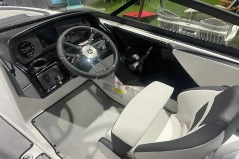 Slide: The Image of 2025 Yamaha Boats AR195 cockpit with steering wheel and modern dashboard design. - 4
