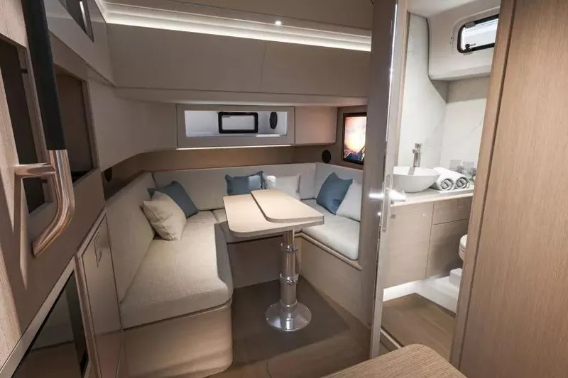 Slide: The Image of Luxurious interior of 2026 Beneteau Gran Turismo 35 yacht with modern seating and bathroom. - 26