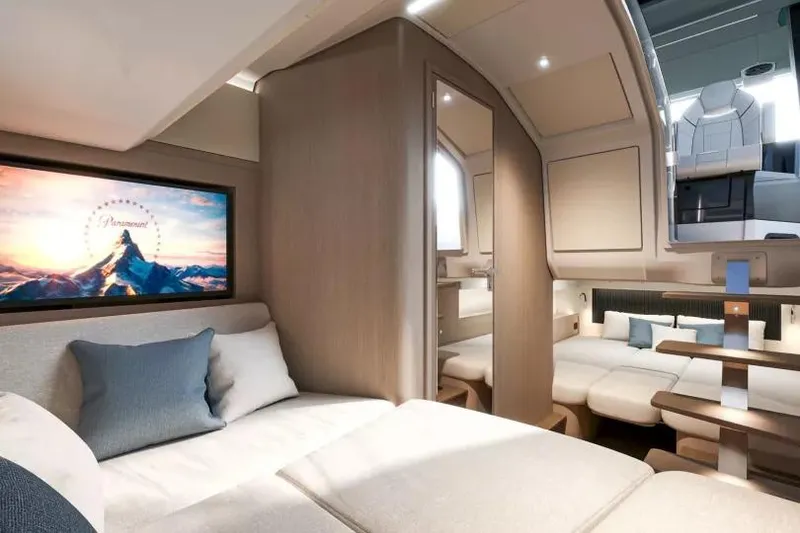 Slide: The Image of Luxurious interior of 2026 Beneteau Gran Turismo 35 yacht with modern furnishings and ambient lighting. - 27