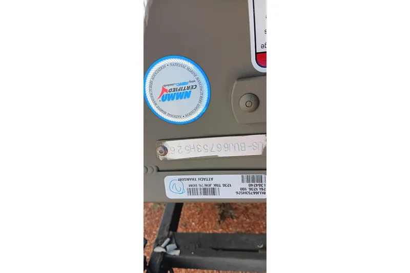 Slide: The Image of 2026 Tracker Topper 1236 boat with certification sticker and identification labels. - 11