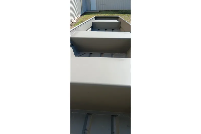 Slide: The Image of 2026 Tracker Topper 1236 boat interior, showcasing seating and storage compartments. - 5