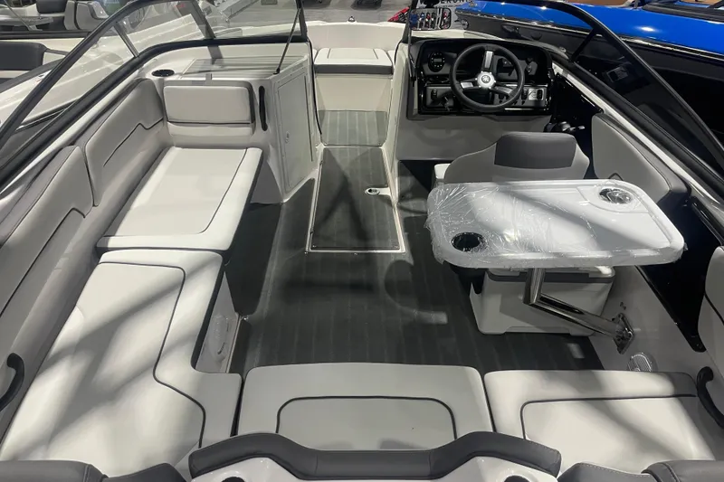 Slide: The Image of 2025 Yamaha AR190 boat interior with seating and steering console. - 4