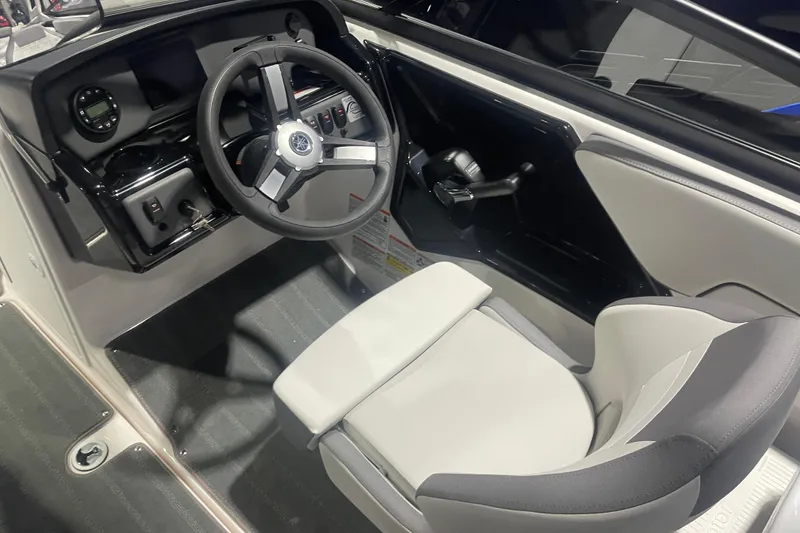 Slide: The Image of 2025 Yamaha AR190 boat interior with steering wheel and control panel. - 5