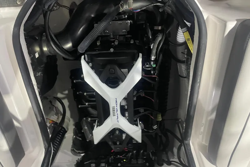 Slide: The Image of Engine compartment of 2025 Yamaha Boats AR190, showcasing high-output components and wiring. - 8