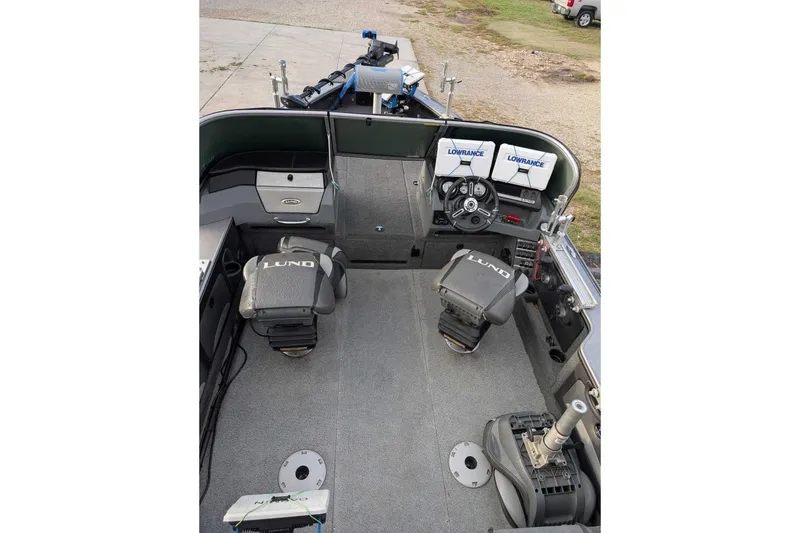 Slide: The Image of 2019 Lund 2075 Pro-V boat interior with Lowrance electronics and seating. - 6