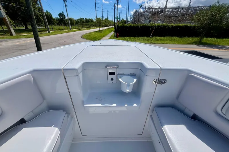 Slide: The Image of 2008 Intrepid 327 Center Console boat interior with seating and storage compartments. - 16