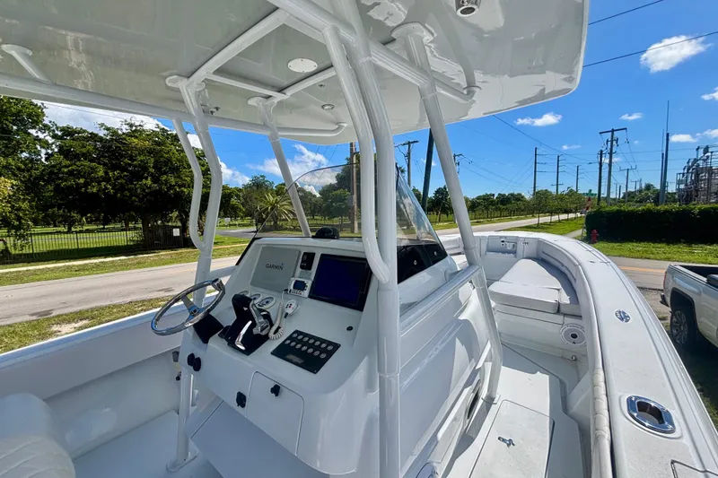 Slide: The Image of 2008 Intrepid 327 Center Console boat with modern helm and navigation equipment. - 24