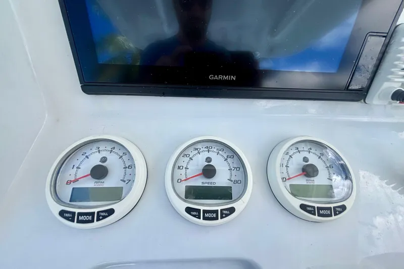 Slide: The Image of Dashboard of a 2008 Intrepid 327 Center Console with Garmin display and gauges. - 29