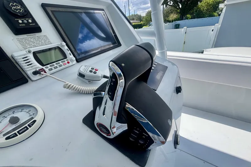 Slide: The Image of 2008 Intrepid 327 Center Console boat dashboard with controls and navigation equipment. - 30