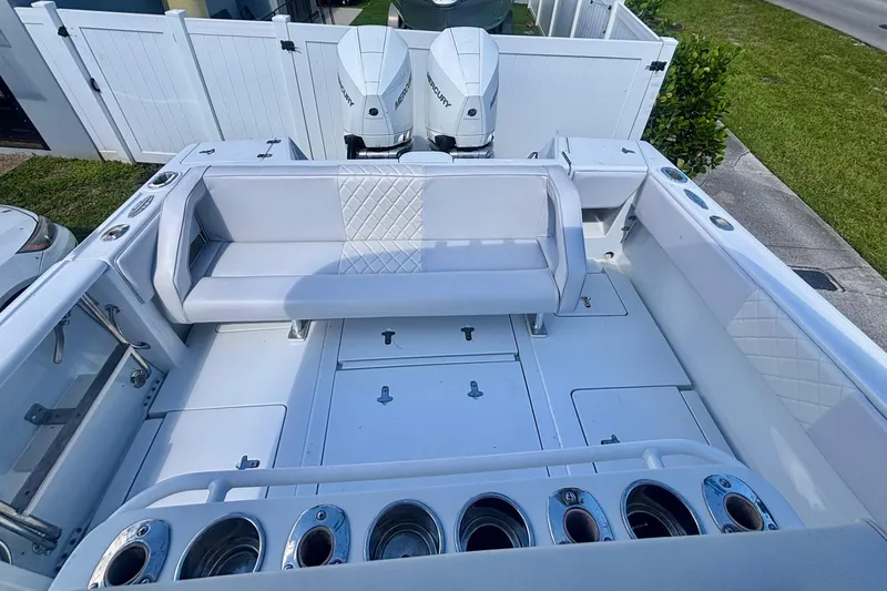 Slide: The Image of 2008 Intrepid 327 Center Console boat interior with seating and dual Mercury engines. - 36