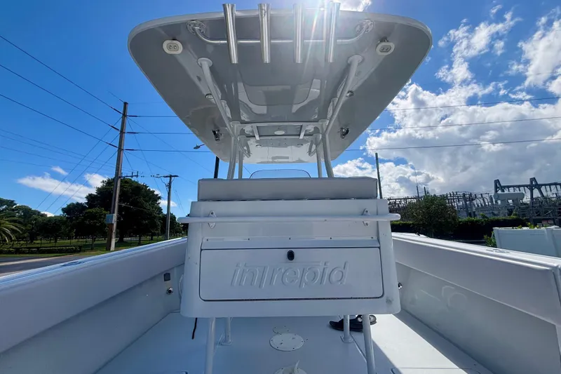 Slide: The Image of 2008 Intrepid 327 Center Console boat under clear blue sky. - 37