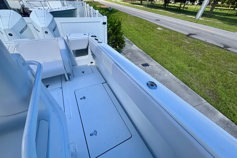 Slide: The Image of 2008 Intrepid 327 Center Console boat interior with seating and storage compartments. - 40