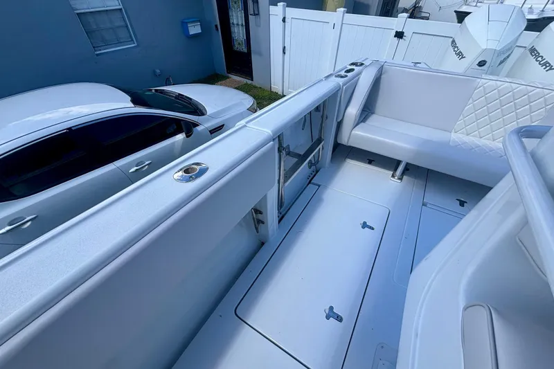 Slide: The Image of 2008 Intrepid 327 Center Console boat interior with seating and storage compartments. - 41