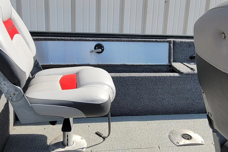 Slide: The Image of 2016 TRACKER MARINE PRO GUIDE V-16 SC boat interior with gray and red seating. - 12
