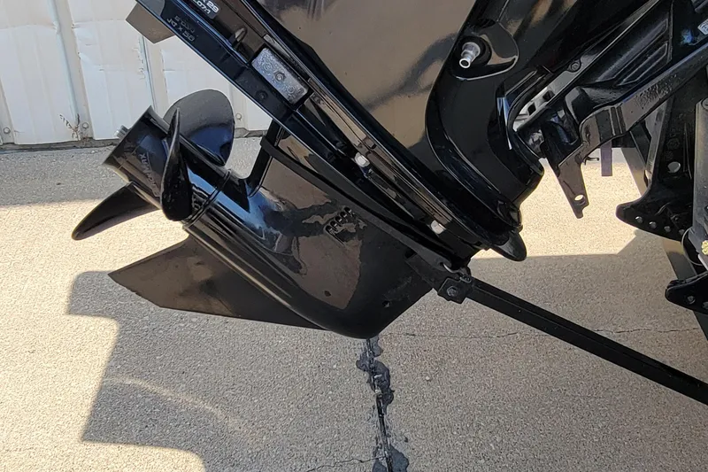 Slide: The Image of 2016 Tracker boat motor propeller on concrete surface, close-up view. - 17