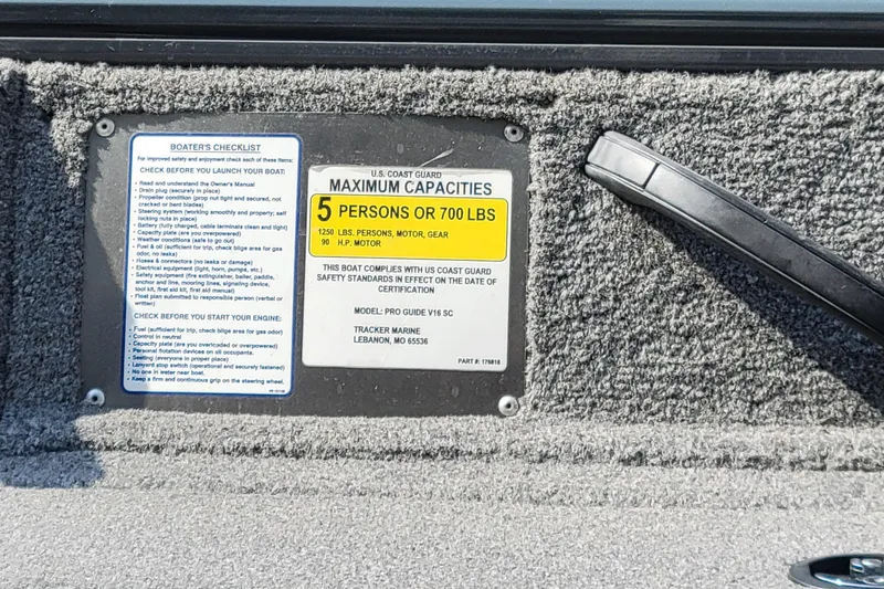 Slide: The Image of Boat capacity and safety checklist label on 2016 Tracker model, maximum 5 persons or 700 lbs. - 19