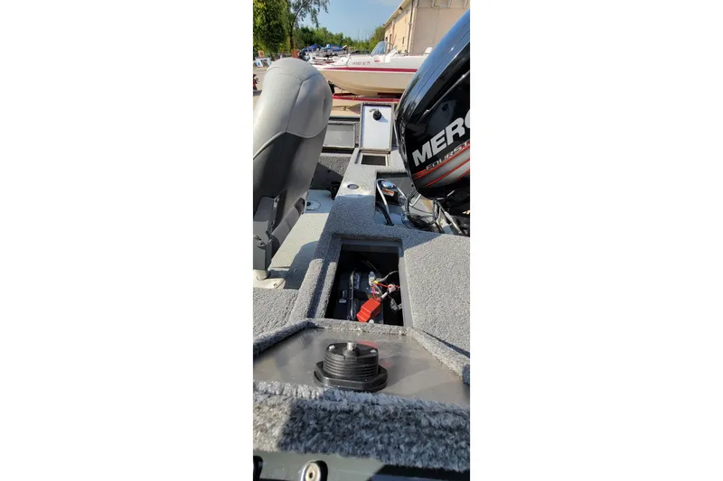 Slide: The Image of 2016 TRACKER MARINE PRO GUIDE V-16 SC boat interior with Mercury engine. - 9