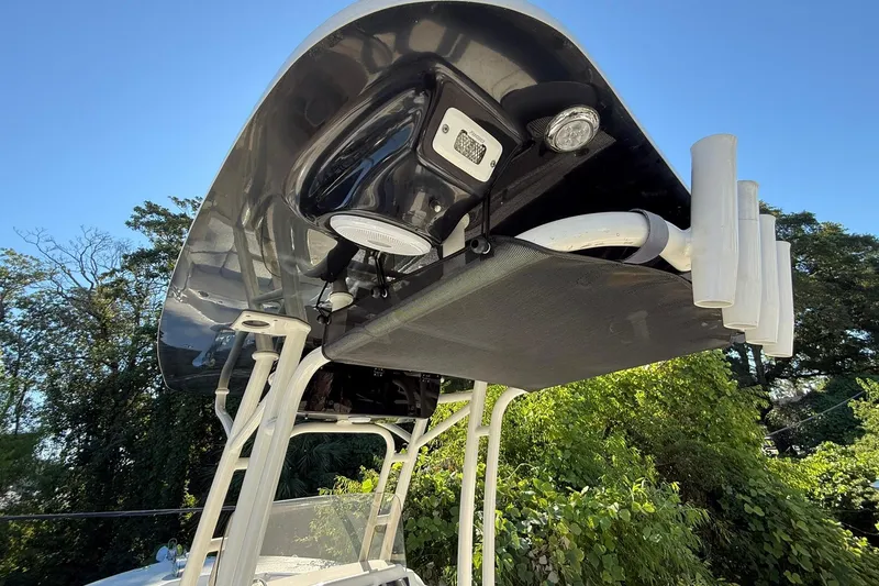 Slide: The Image of 2024 Key West 244 Center Console boat top view with mounted lights and rod holders. - 10