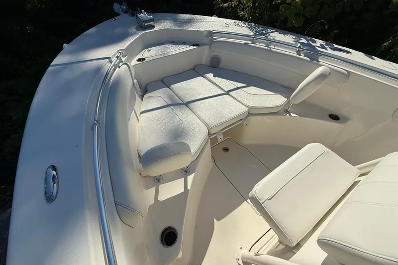 Slide: The Image of 2024 Key West 244 Center Console boat interior with cushioned seating and sleek design. - 4