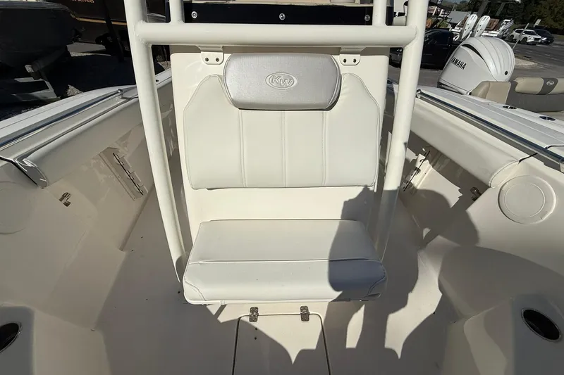 Slide: The Image of 2024 Key West 244 Center Console boat interior with white seating and console. - 5