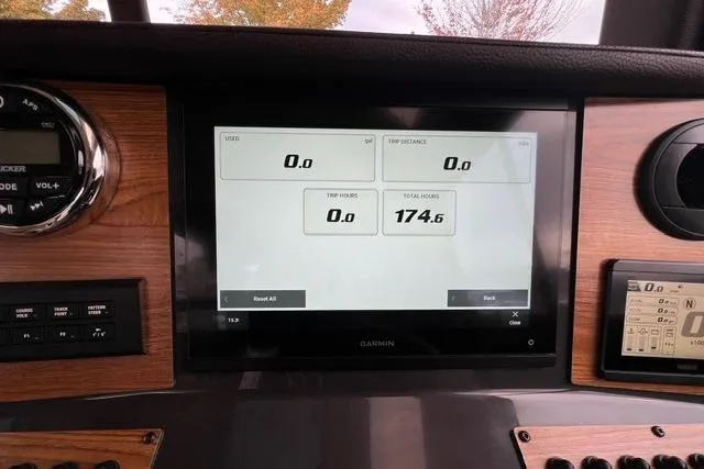 Slide: The Image of Dashboard of 2025 Ranger Tugs R-25 Luxury Edition with Garmin display showing trip data. - 14