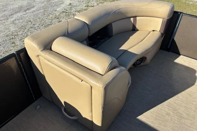 Slide: The Image of 2020 Harris Cruiser 210 boat with beige leather seating, outdoor setting. - 18