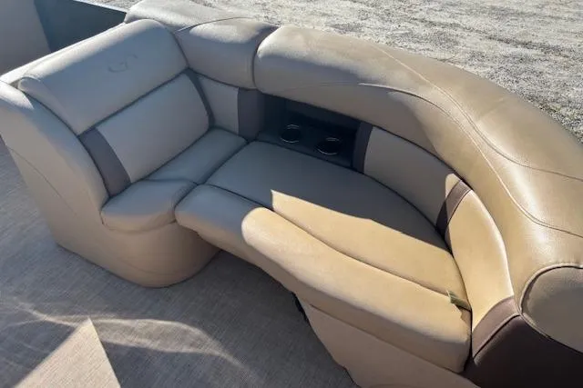 Slide: The Image of Luxurious seating on a 2020 Harris Cruiser 210 pontoon boat, featuring beige upholstery. - 21