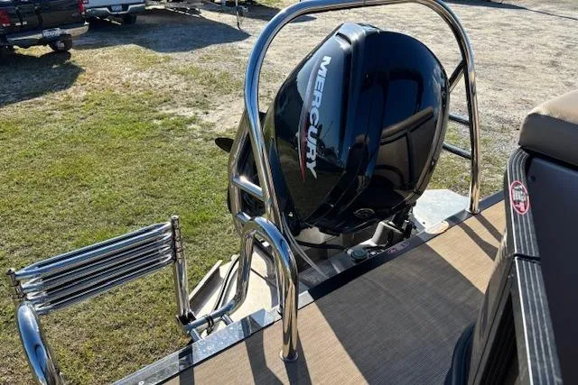 Slide: The Image of 2020 Harris Cruiser 210 boat with Mercury outboard motor and swim ladder. - 8