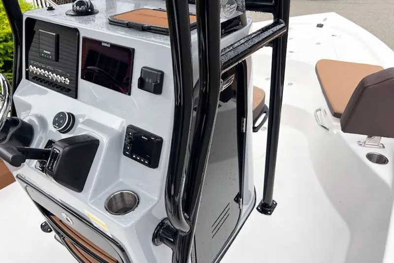 Slide: The Image of 2026 Sea Pro 230 Bay boat console with modern controls and seating. - 13