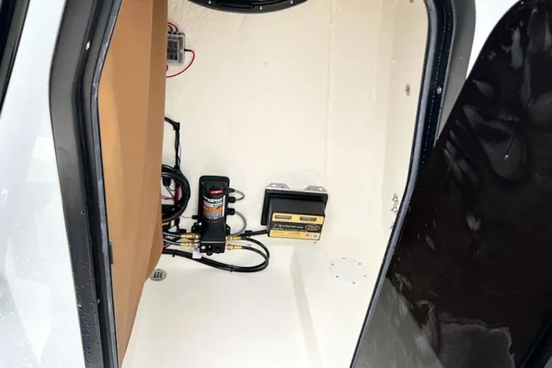 Slide: The Image of Interior view of 2026 Sea Pro 230 Bay boat compartment with equipment. - 14