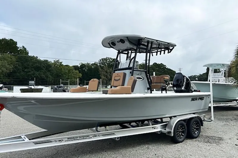 Slide: The Image of 2026 Sea Pro 230 Bay boat on trailer, parked outdoors. - 3