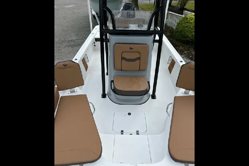 Slide: The Image of 2026 Sea Pro 230 Bay boat interior with tan seating and center console. - 8