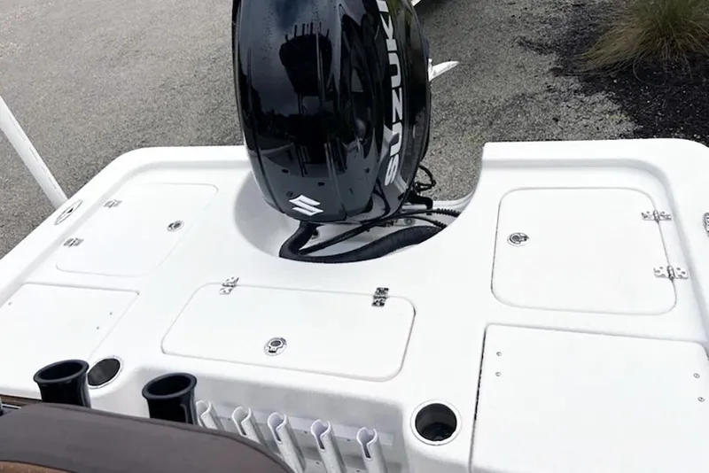 Slide: The Image of 2026 Sea Pro 230 Bay boat with Suzuki outboard motor, featuring storage compartments. - 9
