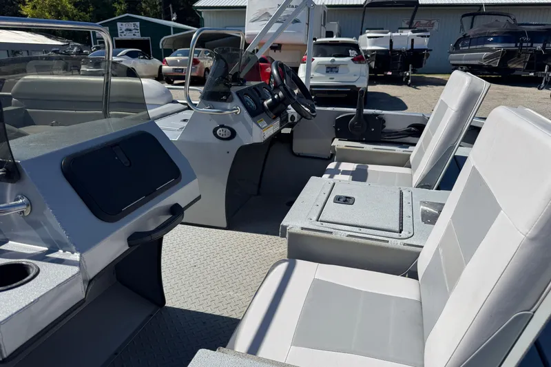 Slide: The Image of 2014 SeaArk Easy 200 boat interior with seating and control panel. - 2