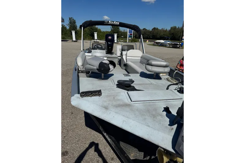 Slide: The Image of 2014 SeaArk Easy 200 boat with seating and equipment on a sunny day. - 3