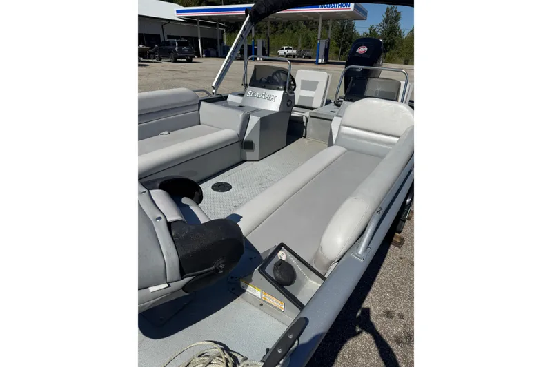 Slide: The Image of 2014 SeaArk Easy 200 boat interior with seating and steering console. - 5