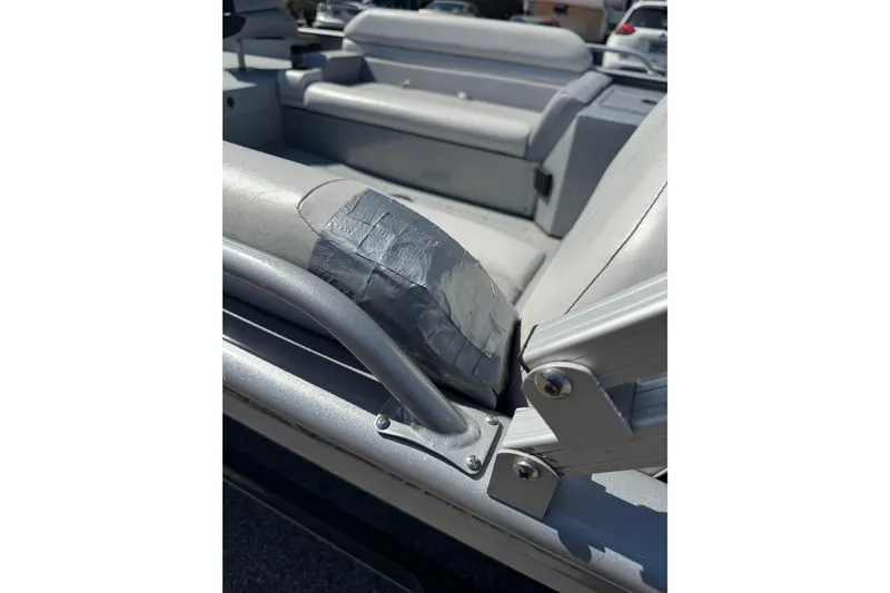 Slide: The Image of 2014 SeaArk Easy 200 boat interior with duct tape repair on seat cushion. - 7