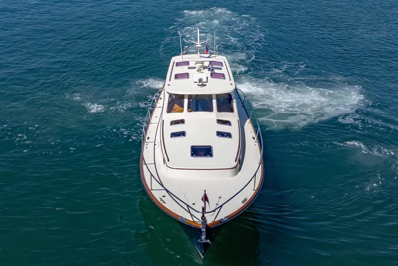 Slide: The Image of 2009 Hinckley Talaria 44 MY yacht cruising on open water. - 13