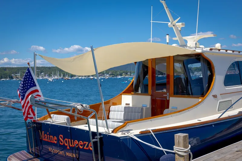 Slide: The Image of Hinckley Talaria 44 MY 2009 yacht docked in Rockport, Maine, with American flag. - 19