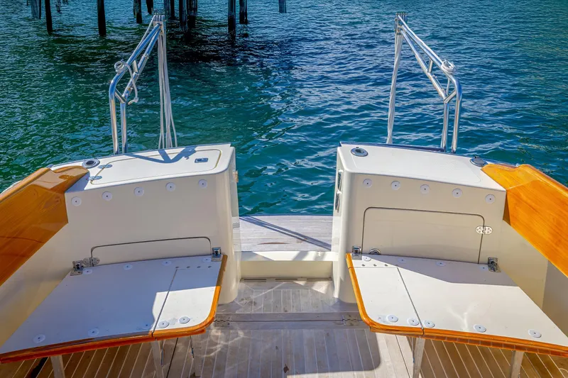 Slide: The Image of Hinckley Talaria 44 MY 2009 yacht deck with wooden accents and ocean view. - 25