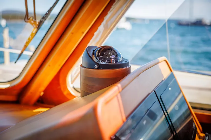 Slide: The Image of Compass on 2009 Hinckley Talaria 44 MY yacht, with ocean view through windows. - 40